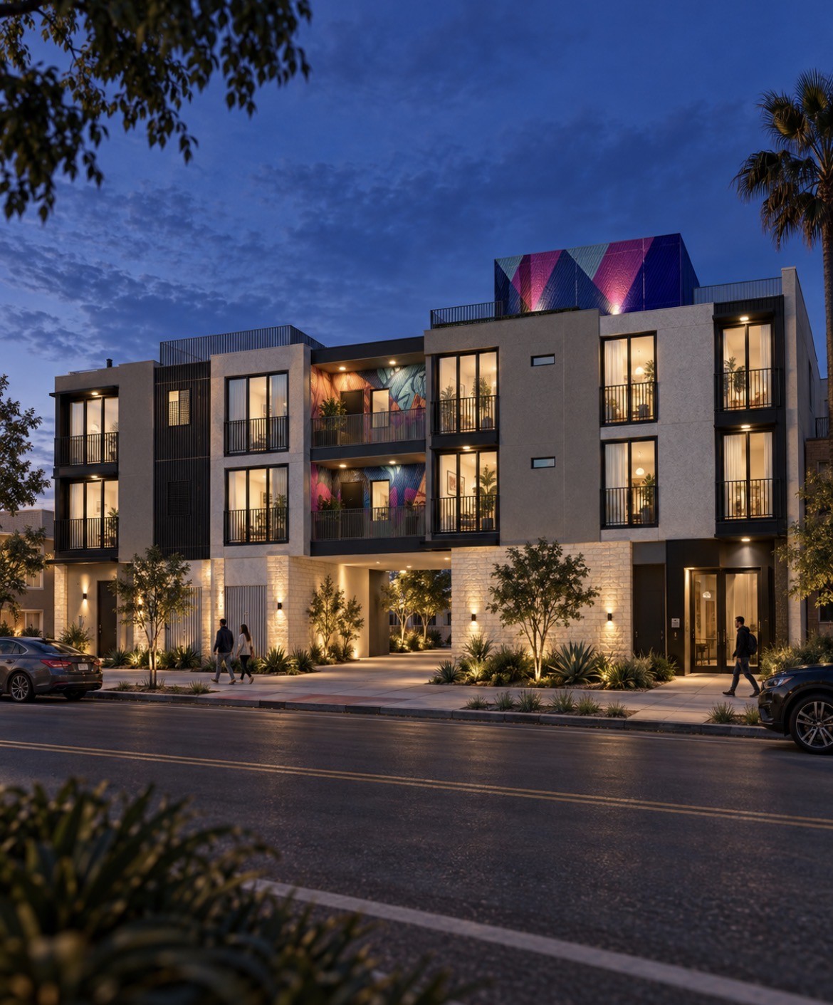 3418 Ray Street multifamily dusk rendering Dusk rendering of the three-story North Park apartment building at 3418 Ray Street with lit balconies, mural walls and a ground-level parking entry