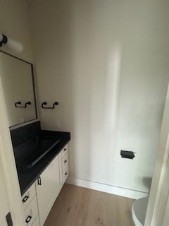Bathroom vanity with black countertop Bathroom vanity with black countertop