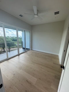 Bedroom with sliding glass door to private balcony Bedroom with sliding glass door to private balcony