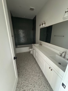 Primary bathroom with tile shower and double vanity Primary bathroom with tile shower and double vanity