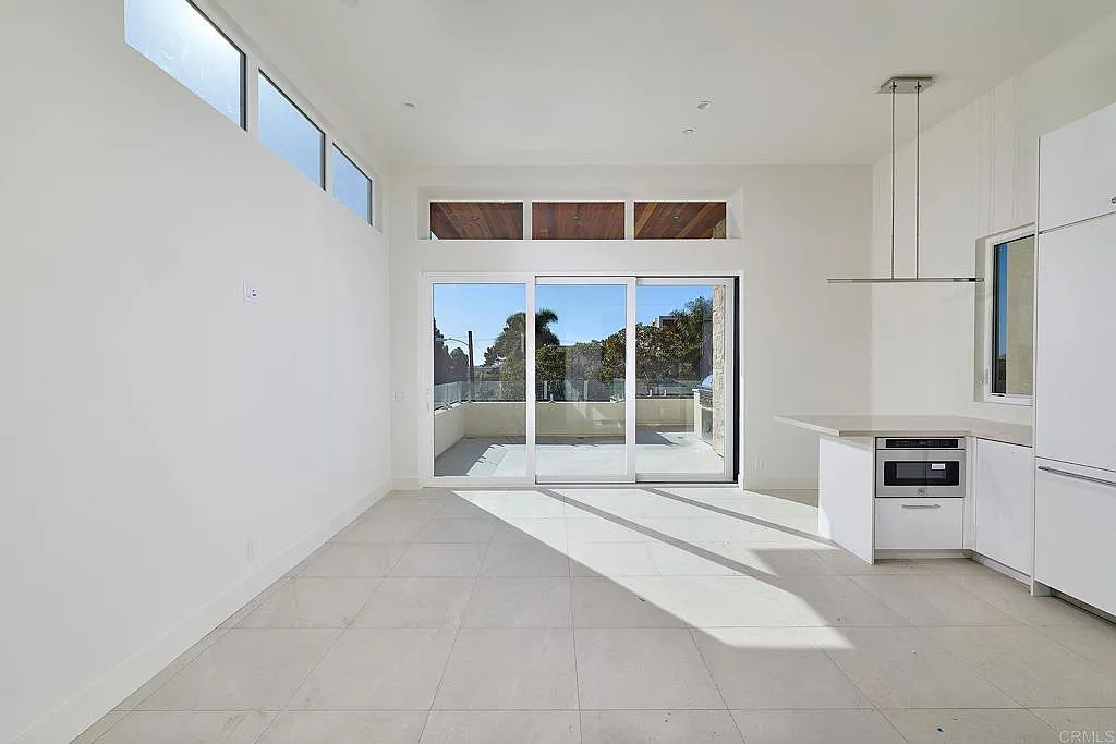 Living and dining area with kitchen island Living and dining area with kitchen island
